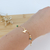 PULSEIRA DE BORBOLETAS COM PEDRAS COLORIDAS BANHADA A OURO 18K