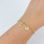 PULSEIRA DE FILHOS 1 MENINO E CORAÇÃO COM INICIAL VAZADA BANHADA A OURO 18K