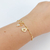 PULSEIRA DE BOLINHA COM 1 MENINA E CORAÇÃO COM INICIAL VAZADA BANHADO A OURO 18K