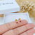 BRINCO INFANTIL BEBÊ ZIRCÔNIAS VERMELHO RUBI BANHADO A OURO 18K na internet
