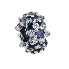 Charm dona con flores y piedras