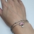 Pulsera con strass y dije flor de loto (A.Q.) - comprar online