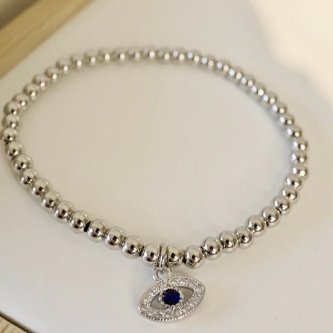 Pulsera bolitas ojito plateado - comprar online