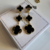 aros 3 trebol dorado y negro - comprar online