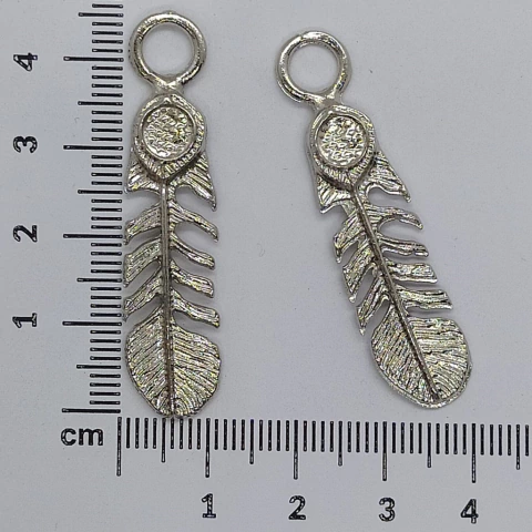 Dije plumas x 25 gramos