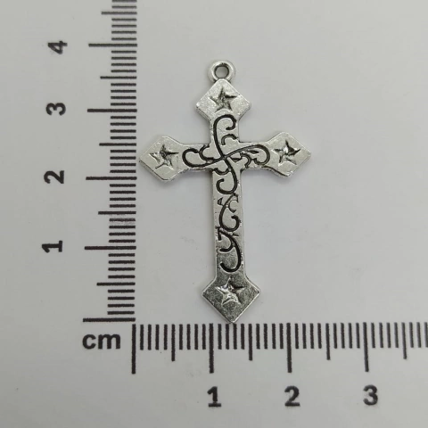 Dije cruz 35mm con estrellas en las puntas x 25 grs.