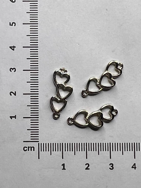 Dije triple corazón con enganche doble x 25gramos