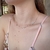 Choker de Prata Medalhas na Lateral e Ponto de Luz Azul Claro