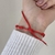 Pulseira Fio Vermelho 7 Nós detalhe em Prata - comprar online