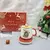Imagem do Conjunto de Natal c/ Caneca + Tampa + Colher + Aquecedor (vários modelos)