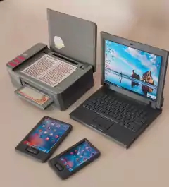 Set de escritorio con computadora portátil, impresora y dos teléfonos móviles en miniatura.
