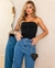 Calça jeans mom com aplicação REF23315 Consciência Jeans na internet