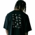 Camiseta LayBack masculina oversized preta com várias estampas pequenas nas costas.