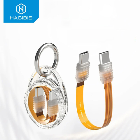 Chaveiro transparente com cabo USB C flexível laranja e conectores prateados, mostrando o cabo enrolado dentro do chaveiro