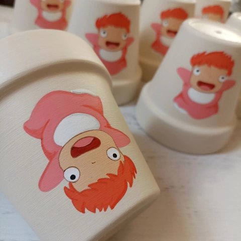 MACETA PINTADA A MANO PONYO PEZ - DOS CRONOPIOS