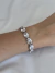 Pulseira Feminina com Zircônias Banhada no Rodio Branco