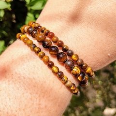 pulseira de olho de tigre em esfera bolinha