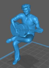 Homem Sentado Tocando Violão