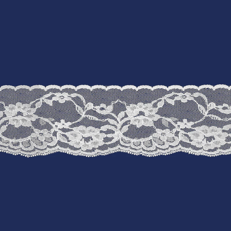 Renda de poliamida branca Najar 900/70 de 70 mm, com padrão floral decorativo, ideal para aviamentos e artesanato.