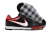 Chuteira Nike Supreme x Nike SB Gato-IC em preto, vermelho e branco, com solado transparente e detalhes em malha.