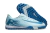 Chuteira Society Nike Mercurial Vapor 16 Academy TF na cor azul, com detalhes em branco e sola com cravos para gramados artificiais.
