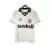 Camisa retrô do Corinthians de 1996, predominantemente branca, com detalhes em preto e marca Suvinil.