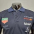 CAMISA POLO F1 RED BULL TRAJE DE CORRIDA -MASCULINA-AZUL/MARINHO na internet