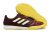 Chuteira Futsal Competition top IC da Adidas, com cabedal em tom vinho e detalhes em amarelo, sola amarela e design moderno.