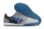 Chuteira Futsal Competition top IC da Adidas, com design em cinza e detalhes em azul, ideal para jogos em quadras. A sola é azul e não marca o chão.