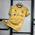 CAMISA REAL SOCIEDAD AWAY 24/25 TORCEDOR-MACRON-MASCULINA-DOURADO na internet