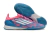 Chuteira futsal Adidas F50 PRO IC nas cores azul e rosa, com detalhe da sola e parte superior.