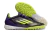 Chuteira futsal Adidas F50 PRO TF em cores vibrantes, com detalhes em preto, roxo e verde. Mostrando a sola com travas para melhor aderência em campo.