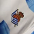 CAMISA REAL SOCIEDAD HOME 23/24 TORCEDOR-MACRON-MASCULINA-AZUL/BRANCA - loja online