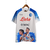Camisa branca do Napoli, edição Champions 23/24, com estampas de jogadores e logotipos do time.