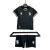 Conjunto infantil de futebol do Vitória de Guimarães, temporada 2024/2025, com camisa preta e calção, detalhes em dourado.