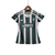 Camisa feminina do Manchester United Away 23/24 da Adidas, com listras verdes e brancas e logo do time.