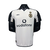 Camisa retrô do Manchester United, comemorativa do 100º aniversário, com detalhes em preto e branco e logo da Vodafone.