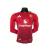 Camisa de manga longa do Manchester United, versão jogador, na cor vermelha, com logotipo da equipe e patrocinador.