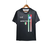 Camisa Napoli Champions versão 23/24 masculina, preta, com detalhes em verde, branco e vermelho.