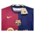 Camisa do Barcelona na temporada 24/25, com as cores azul e grená, destacando o logo do clube e o símbolo da Nike.