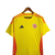 Camisa amarela com detalhes em laranja, modelo torcedor da seleção colombiana, da marca Adidas, para a temporada 24/25.