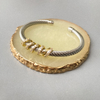 Bracelete Cravejado Torcido Banho Misto Duo - comprar online