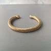 Bracelete Metal Torcido Banhado a Ouro - comprar online