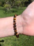 Pulseira de olho de tigre lapidada 6mm - coragem e proteção