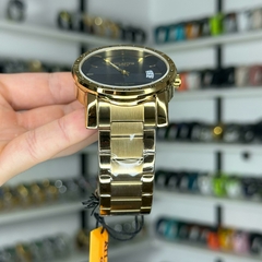 AT G3242 (DOURADO/PRETO) na internet