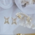 Aros mariposa clip con perlas en internet
