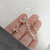 Aros mariposa clip con perlas - Merlina Tiendita