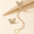 Aros mariposa clip con perlas - Merlina Tiendita