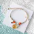 Pulsera con flor encapsulada