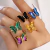 Anillo mariposa de acrílico